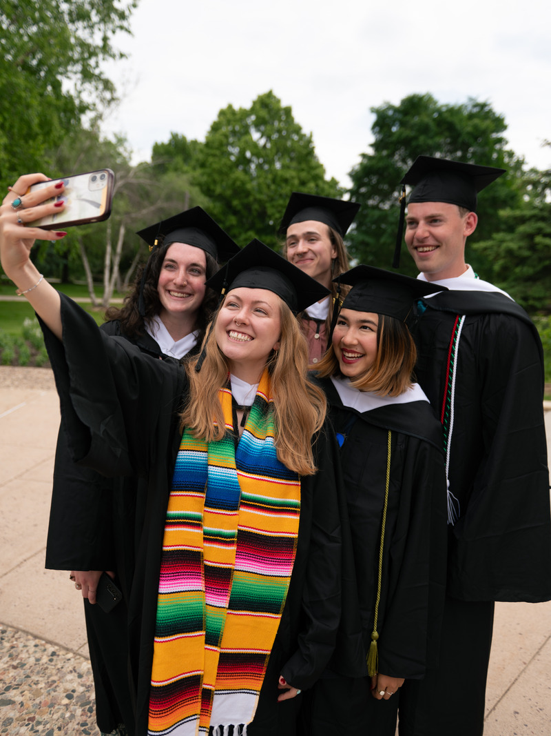 Graduating students taking a picture together.